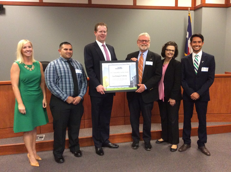 Receiving the award at the board meeting.